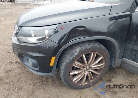 2014 Volkswagen Tiguan Sel z USA, uszkodzony, nr VIN WVGBV3AX2EW525813